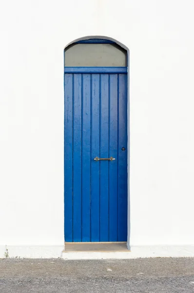 Blue narrow timber door on the white background — Stock Photo, Image