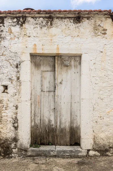 Blue narrow timber door on the white background — Stock Photo, Image