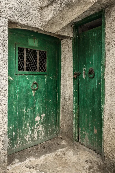 Blue narrow timber door on the white background — Stock Photo, Image