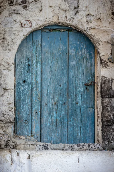 Blue narrow timber door on the white background — Stock Photo, Image