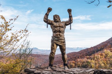 SOCHI, RUSSIA NOVEMBER 23, 2015: Statue of Unbound Prometheus with Broken Chain on the Eagle Rocks clipart