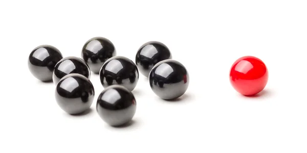 Concept with red and black marbles -  Mobbing — Stock Photo, Image