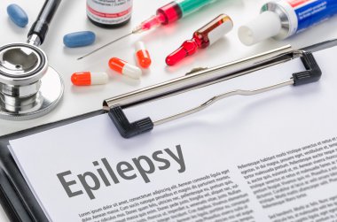 The diagnosis Epilepsy written on a clipboard clipart
