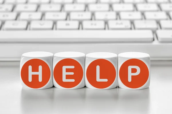 Letter dice in front of a keyboard - Help — Stock Photo, Image