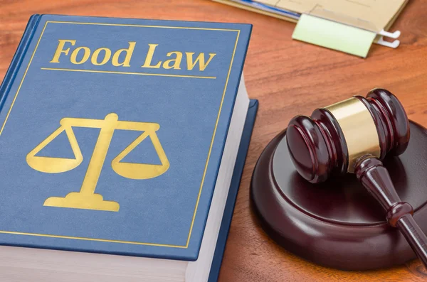 A law book with a gavel - Food law — Stock Photo, Image