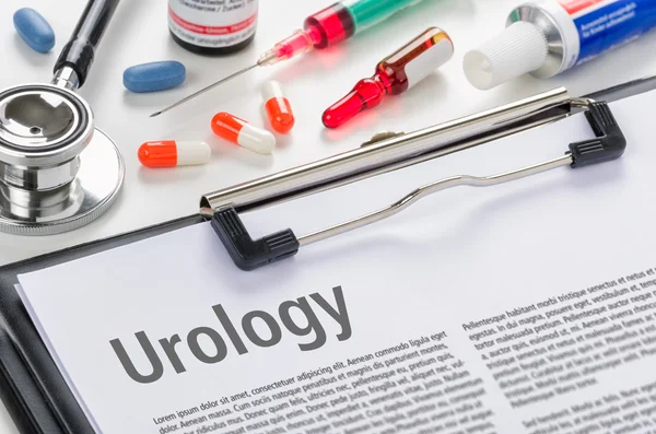 Especialidade médica Urologia escrita em uma área de transferência — Fotografia de Stock
