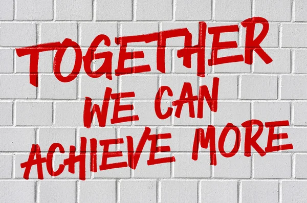 Graffiti on a brick wall - Together we can achieve more — Stock Photo, Image