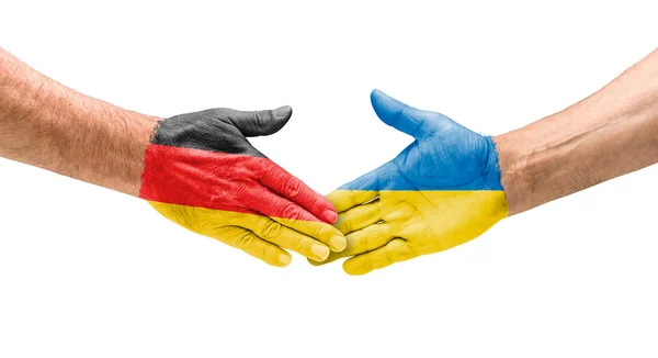 Футбольних команд - рукостискання між Україною та Німеччиною — стокове фото