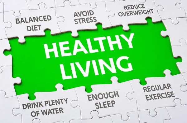 Text on puzzle pieces - Healthy living — Stock Photo, Image