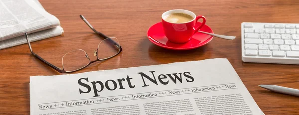 A newspaper on a wooden desk - Sport News — Stock Photo, Image