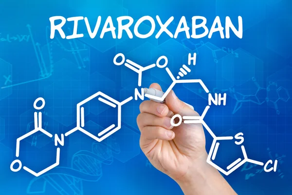 Hand with pen drawing the chemical formula of Rivaroxaban — Stock Photo, Image