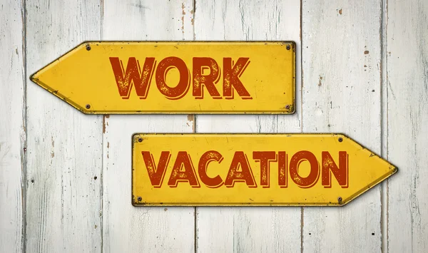 Direction signs on a wooden wall - Work or Vacation — Stock Photo, Image