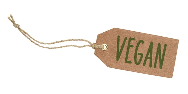 Etiqueta sobre un fondo blanco con el texto Vegano —  Fotos de Stock