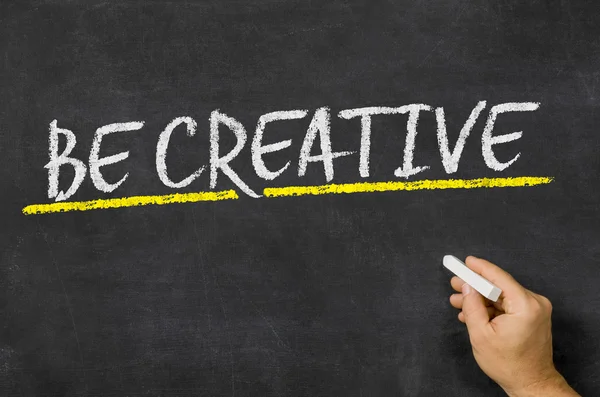 Be creative written on a blackboard — Stock Photo, Image