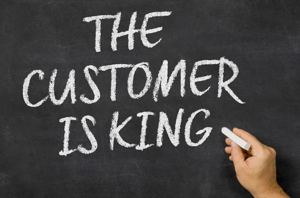 The customer is king written on a blackboard — Stock Photo, Image