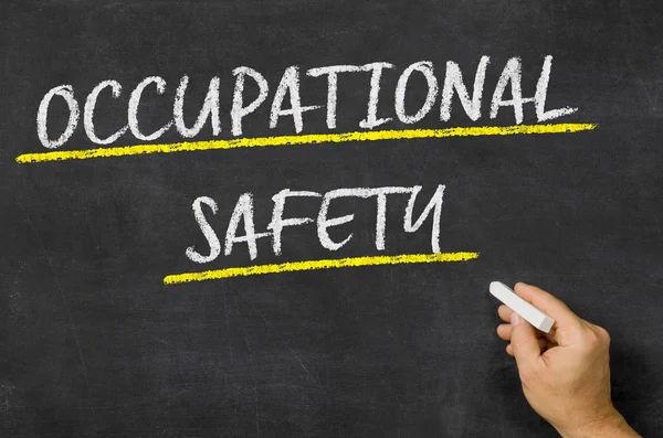 Occupational safety written on a blackboard — Stock Photo, Image