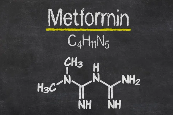 Blackboard with the chemical formula of Metformin — Stock Photo, Image