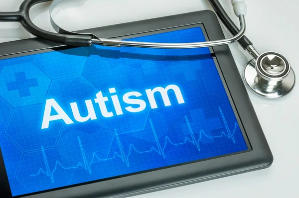 Tablet with the text Autism on the display — Stock Photo, Image