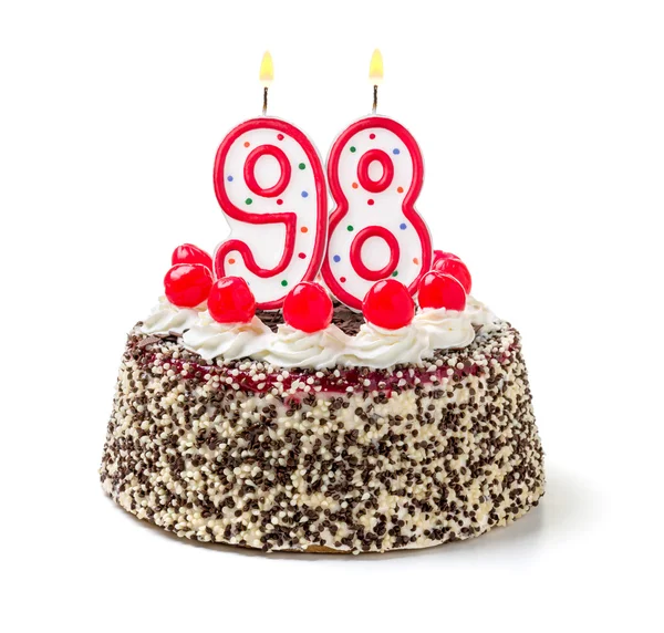 Birthday cake with a burning candle — Stock Photo, Image