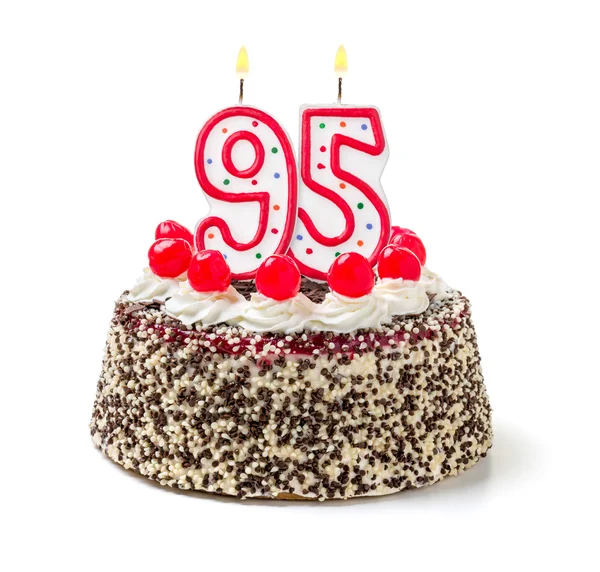 Birthday cake with a burning candle — Stock Photo, Image