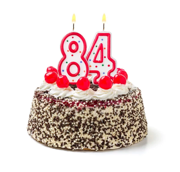 Tort urodzinowy z płonącą świeczkę — Zdjęcie stockowe