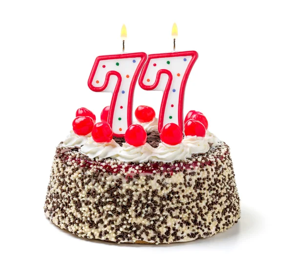 Birthday cake with a burning candle — Stock Photo, Image