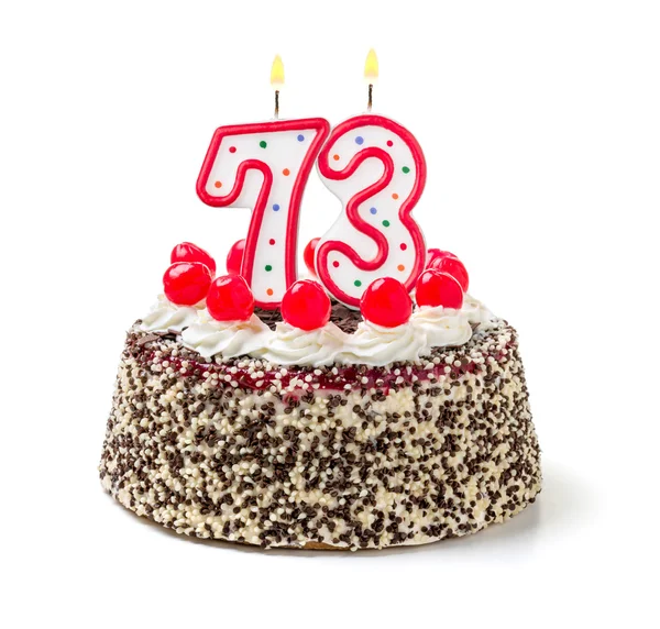 Торт на день рождения с горящей свечой — стоковое фото