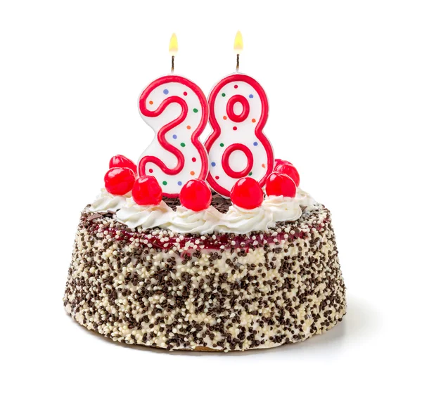 Birthday cake with a burning candle — Stock Photo, Image