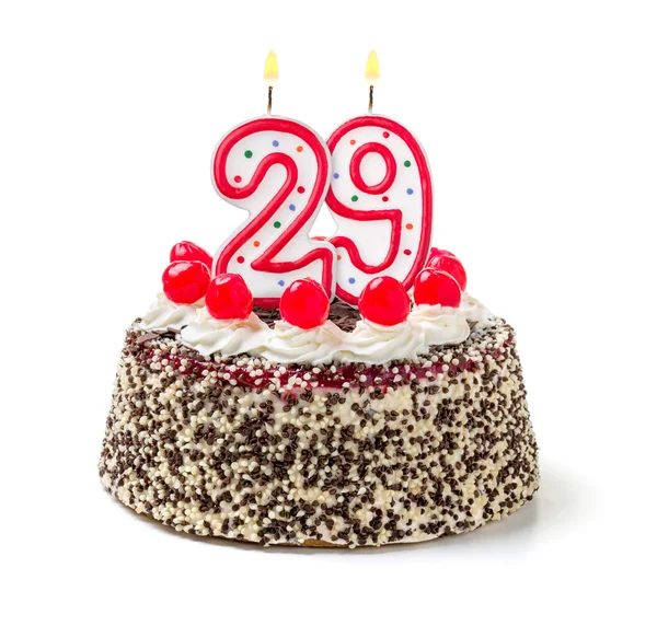 Birthday cake with a burning candle — Stock Photo, Image