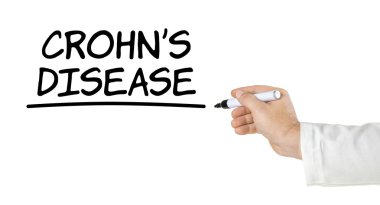 Hand with pen writing Crohns Disease clipart