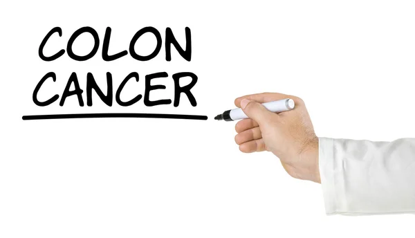 Hand with pen writing Colon Cancer — Stock Photo, Image