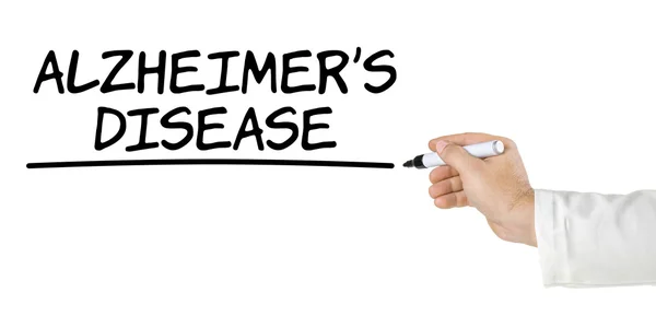 Hand with pen writing Alzheimers Disease — Stock Photo, Image