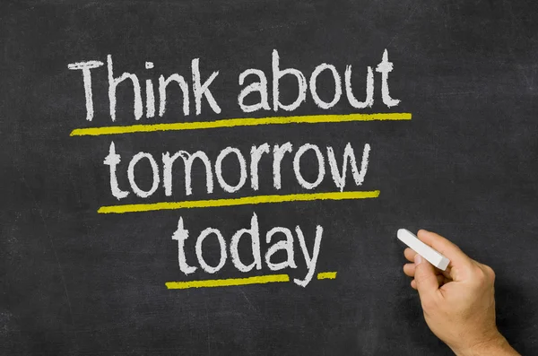 Blackboard with the text Think about tomorrow today — Stock Photo, Image