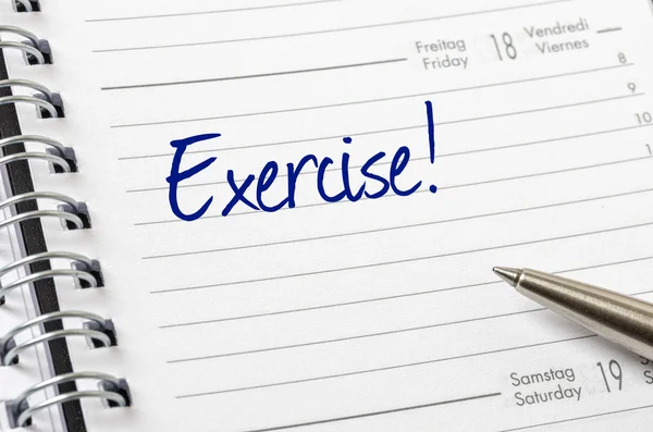 Exercício escrito em uma página de calendário — Fotografia de Stock