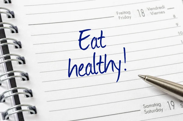 Eat healthy written on a calendar page — Stock Photo, Image