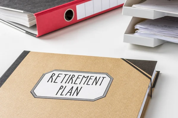 A folder with the label Retirement Plan — Stock Photo, Image