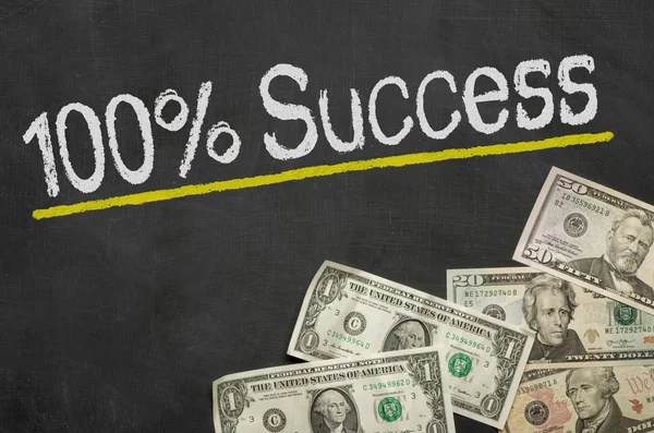 Text on blackboard with money - 100 percent success — Stock Photo, Image