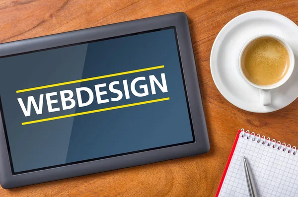 Tableta sobre un escritorio - Webdesign —  Fotos de Stock