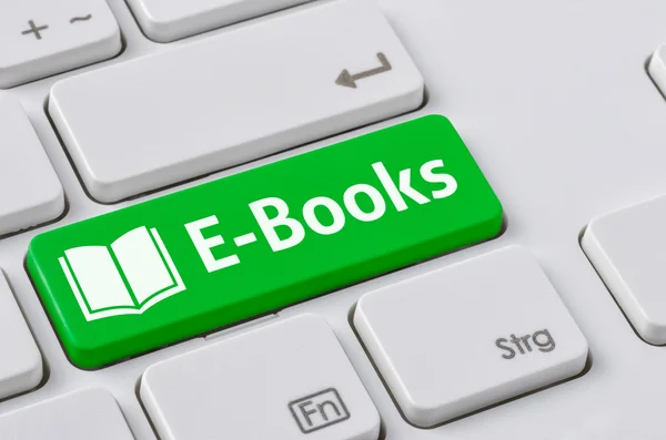 Een toetsenbord met een groene knop - E-Books — Stockfoto