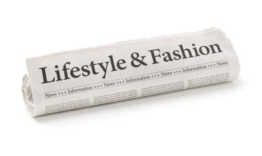 Rolled newspaper with the headline Lifestyle and Fashion clipart