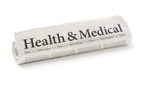 Rolled newspaper with the headline Health and Medical — Stock Photo, Image