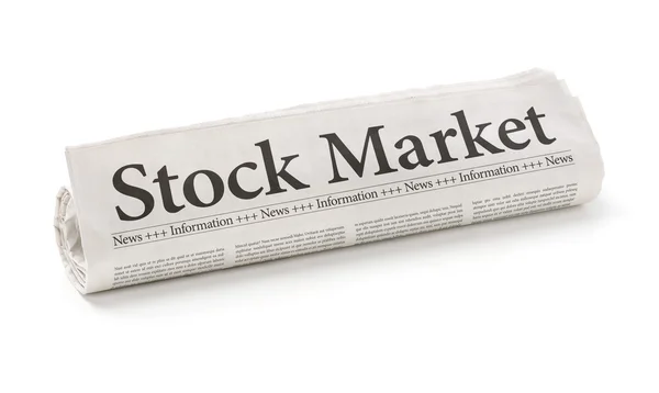 Rolled newspaper with the headline Stock Market — Stock Photo, Image