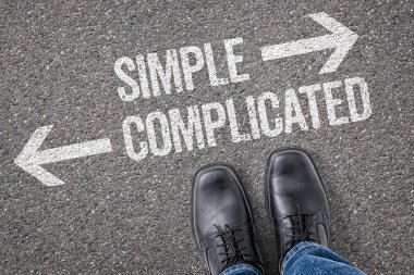 Decision at a crossroad - Simple or Complicated clipart