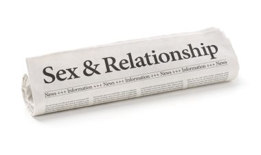 Rolled newspaper with the headline Sex and Relationship clipart