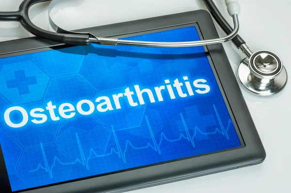 Comprimido com o diagnóstico Osteoartrite na tela — Fotografia de Stock