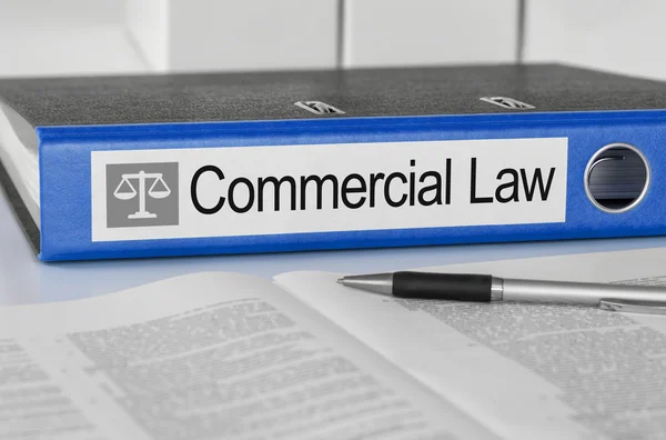 Blue folder with the label Commercial Law — Stock Photo, Image