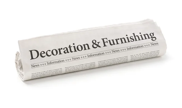 Rolled newspaper with the headline Decorating and Furnishing — Stock Photo, Image