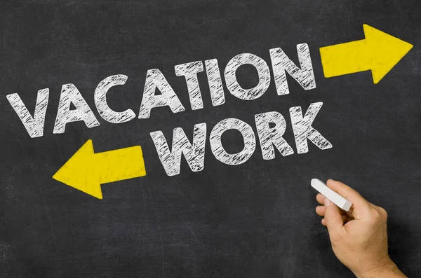 Vacation or Work written on a blackboard — Stock Photo, Image