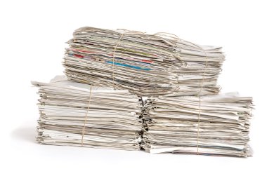 Bundles of newspapers on a white background clipart