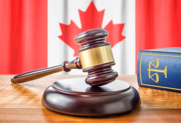 A gavel and a law book - Canada — Zdjęcie stockowe